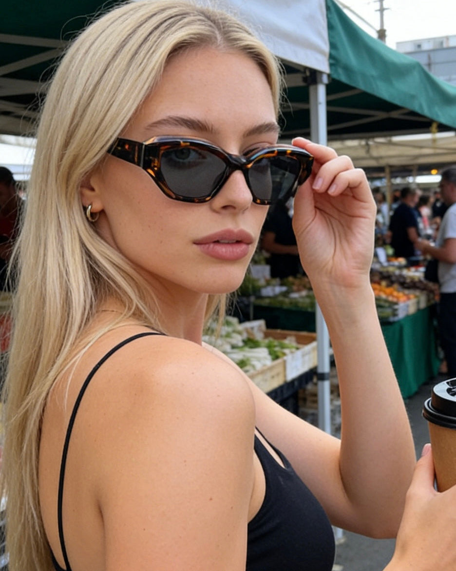 Stylish unisex polarized cat-eye sunglasses by By Charley, featuring a classic tortoiseshell frame that offers 100% UV protection and glare reduction for a bold, vintage-inspired aesthetic.