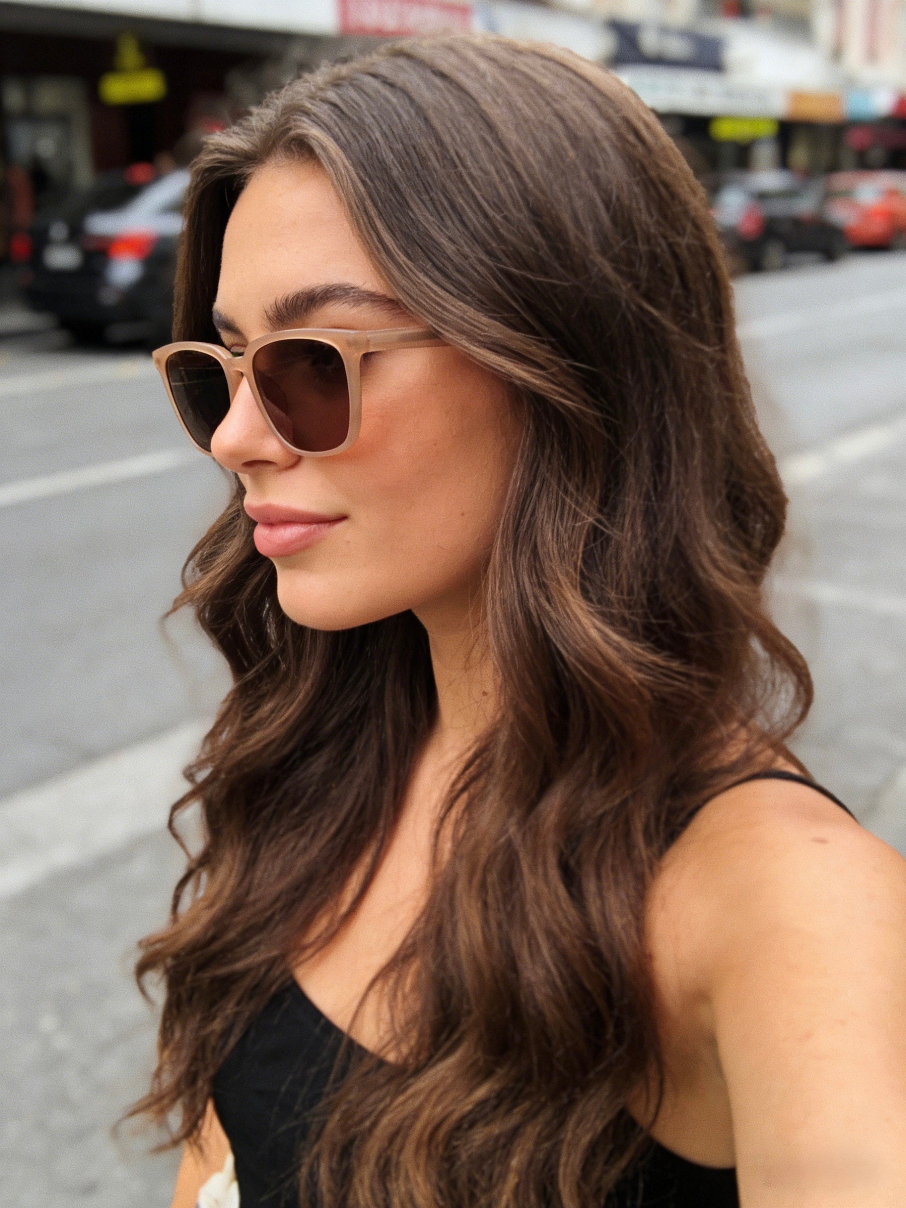 Beige polarized sunglasses for women with UV protection, classic square frames in neutral tones.