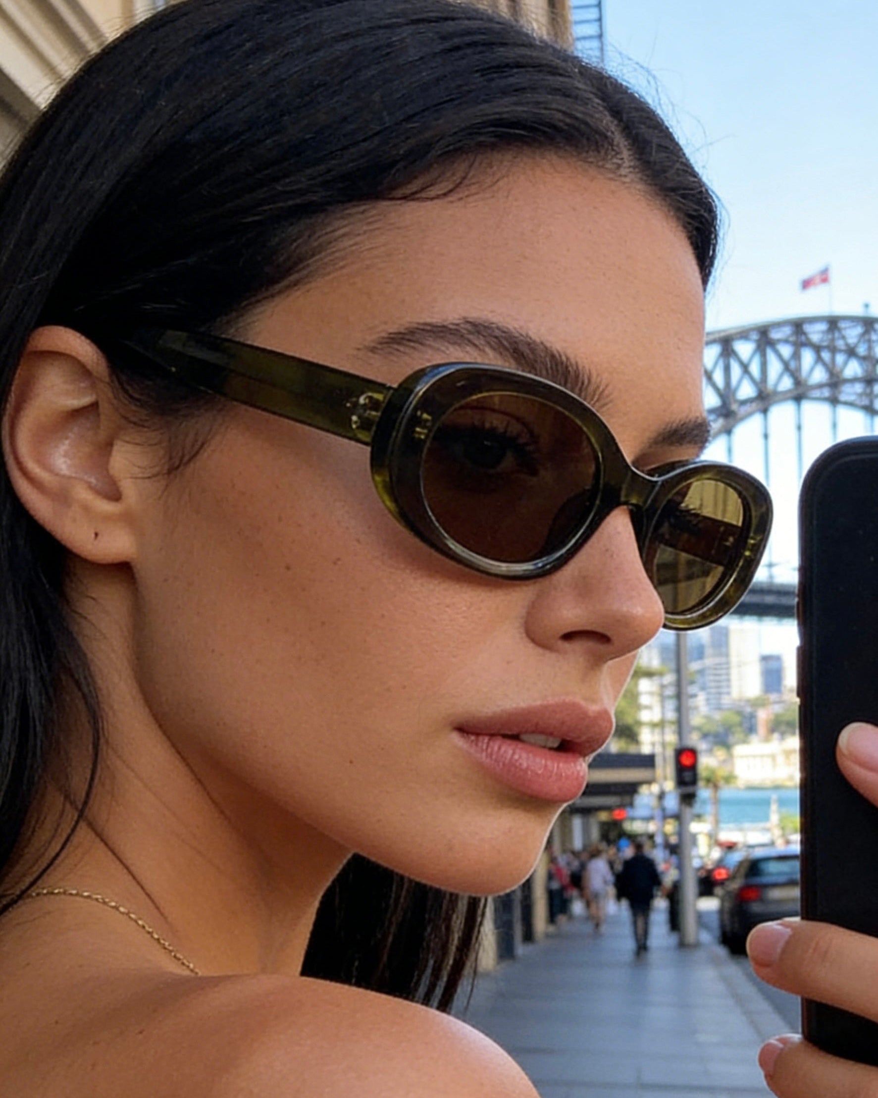 Polarized olive green oval sunglasses, UV400 protective lenses, stylish retro shades with a translucent frame.Translucent olive green oval sunglasses with polarized tea lenses and UV protection, vintage aesthetic eyewear for women.