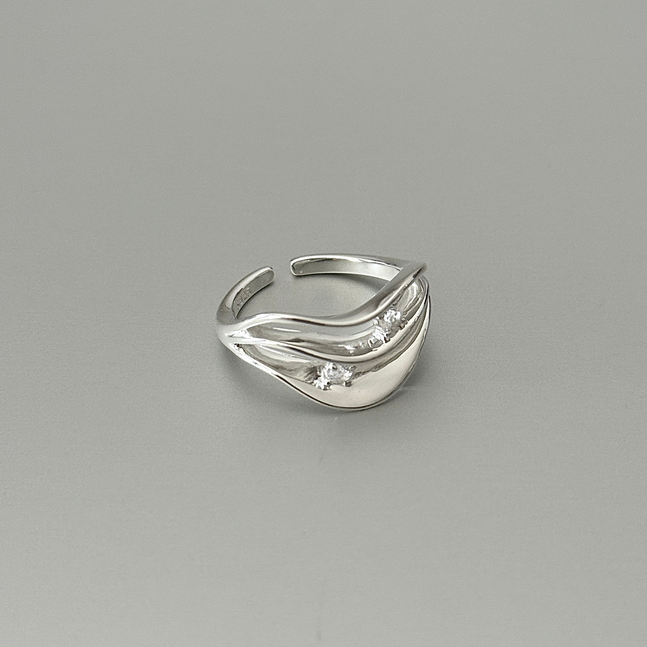 925 sterling silver with cubic zircon, sleek wave design for modern versatile jewelry