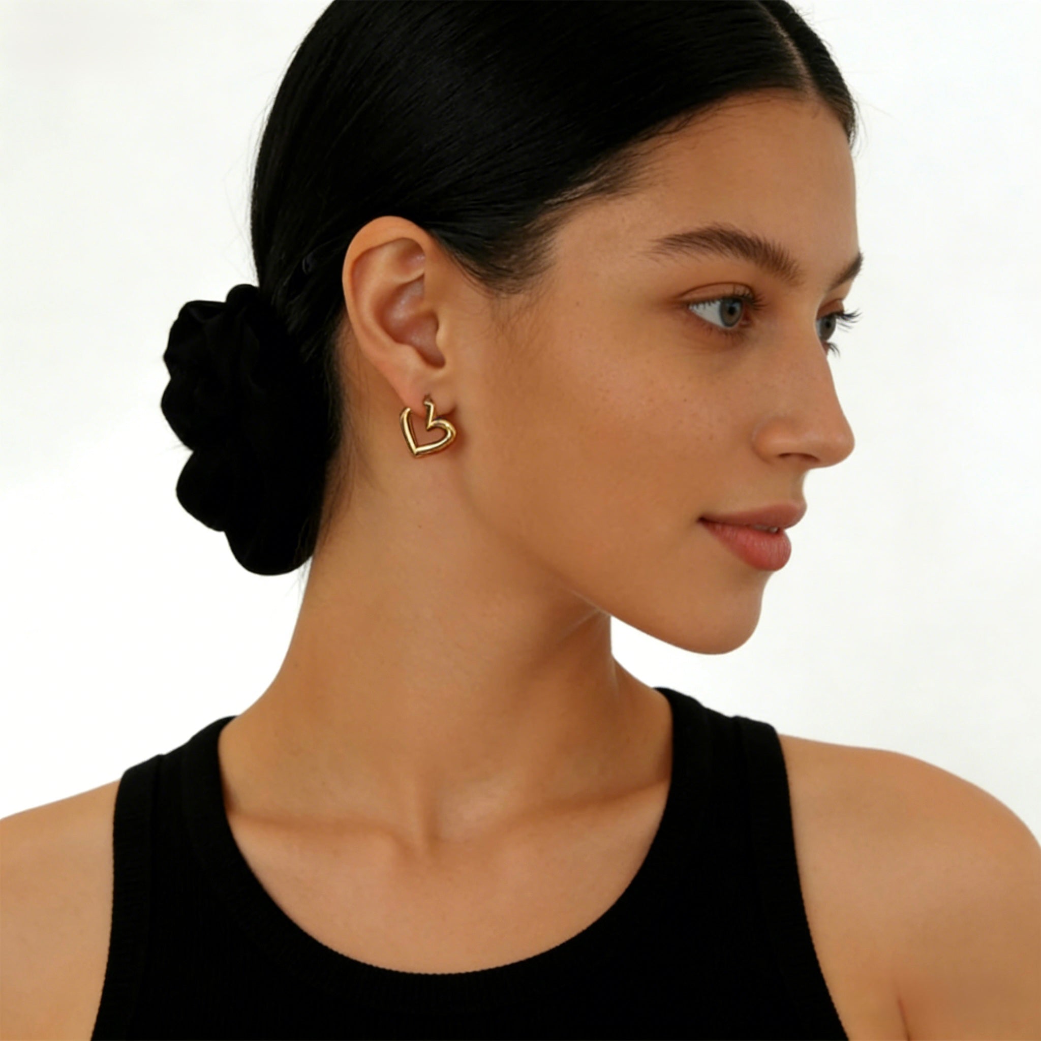 Pair of minimalist 18K gold plated heart hoop earrings featuring unique V-shape architectural lines and S925 sterling silver posts for sensitive ears