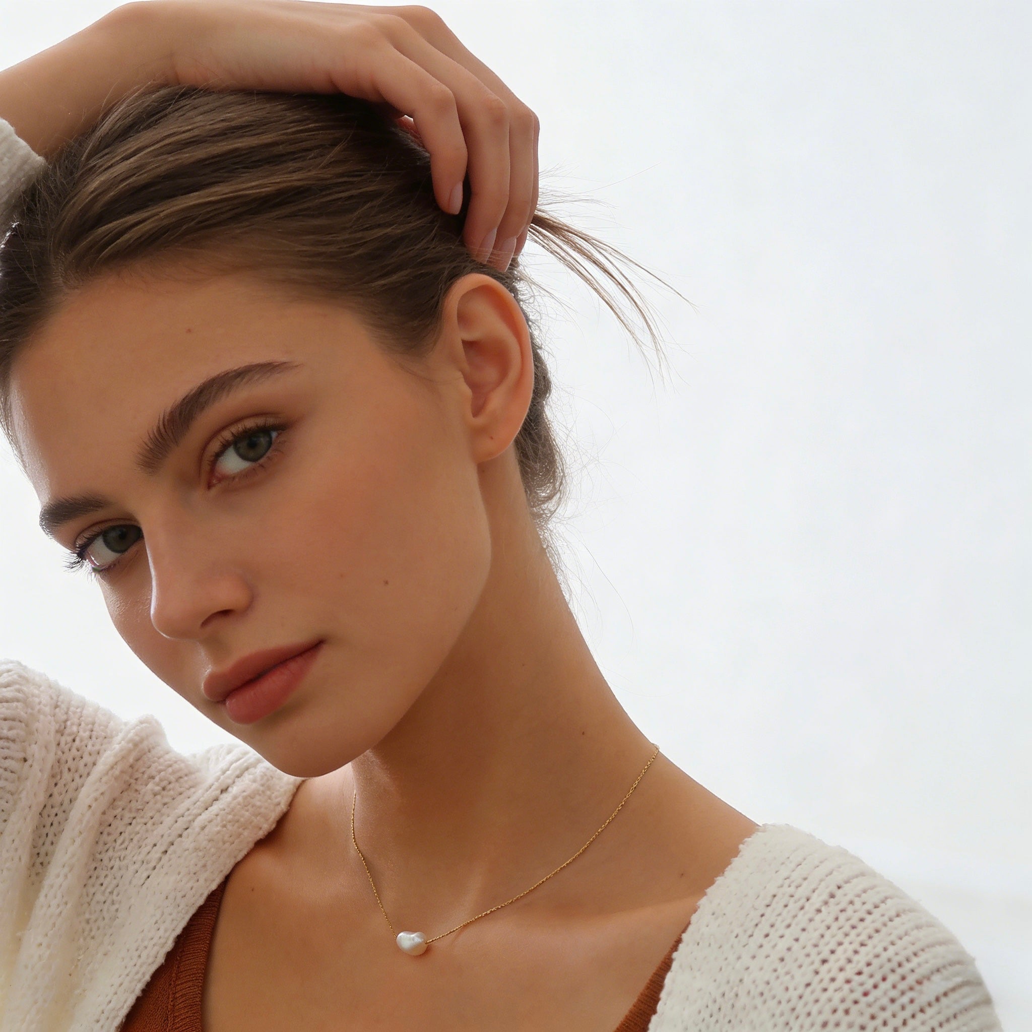 Minimalist 18K gold plated floating necklace with a natural white freshwater baroque pearl on a dainty cable chain