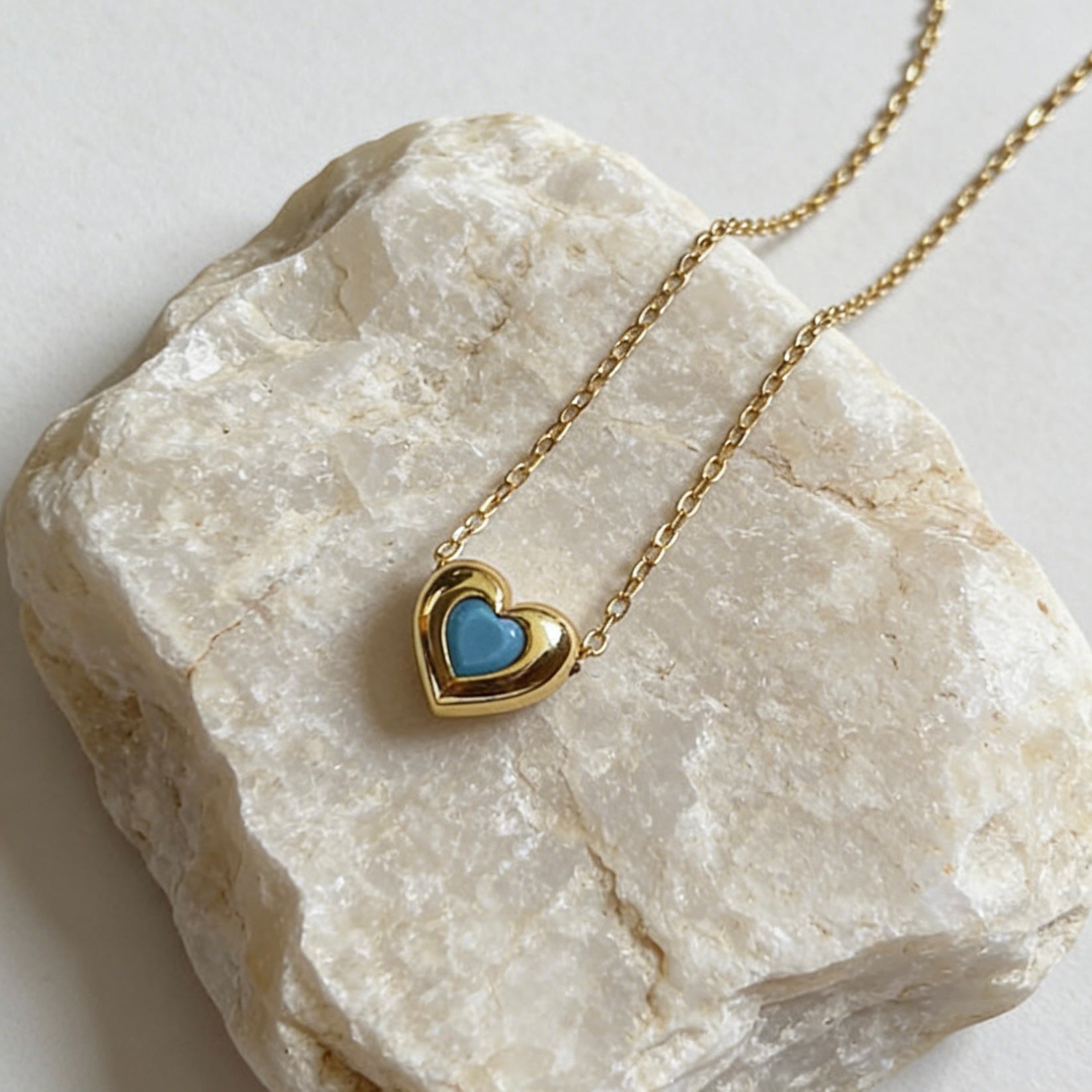 18K gold plated over sterling silver heart-in-heart green zircon necklace featuring a central black heart-shaped zircon on a dainty gold chain