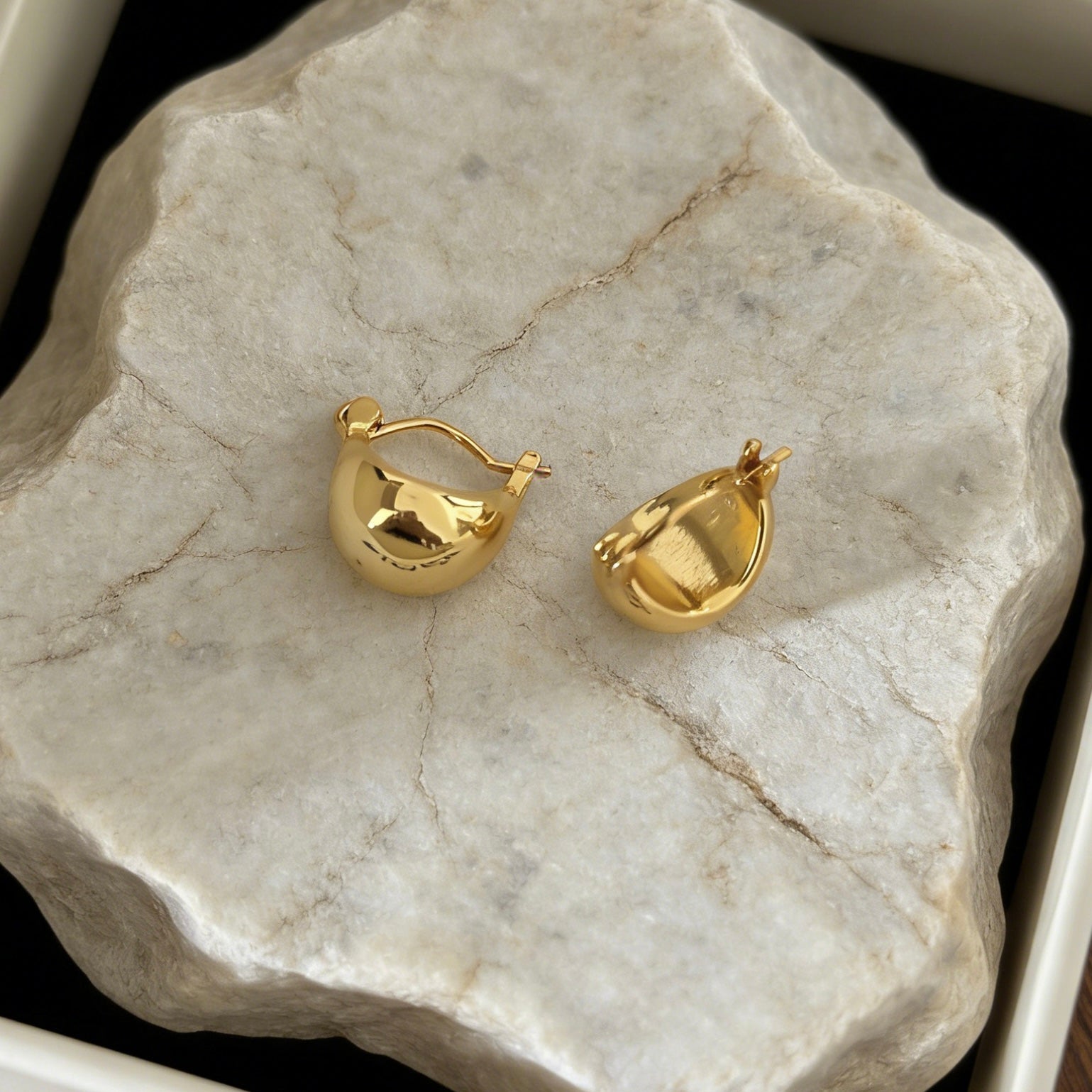 Pair of minimalist 18K gold plated chubby hoop earrings with a high-polished waterdrop silhouette