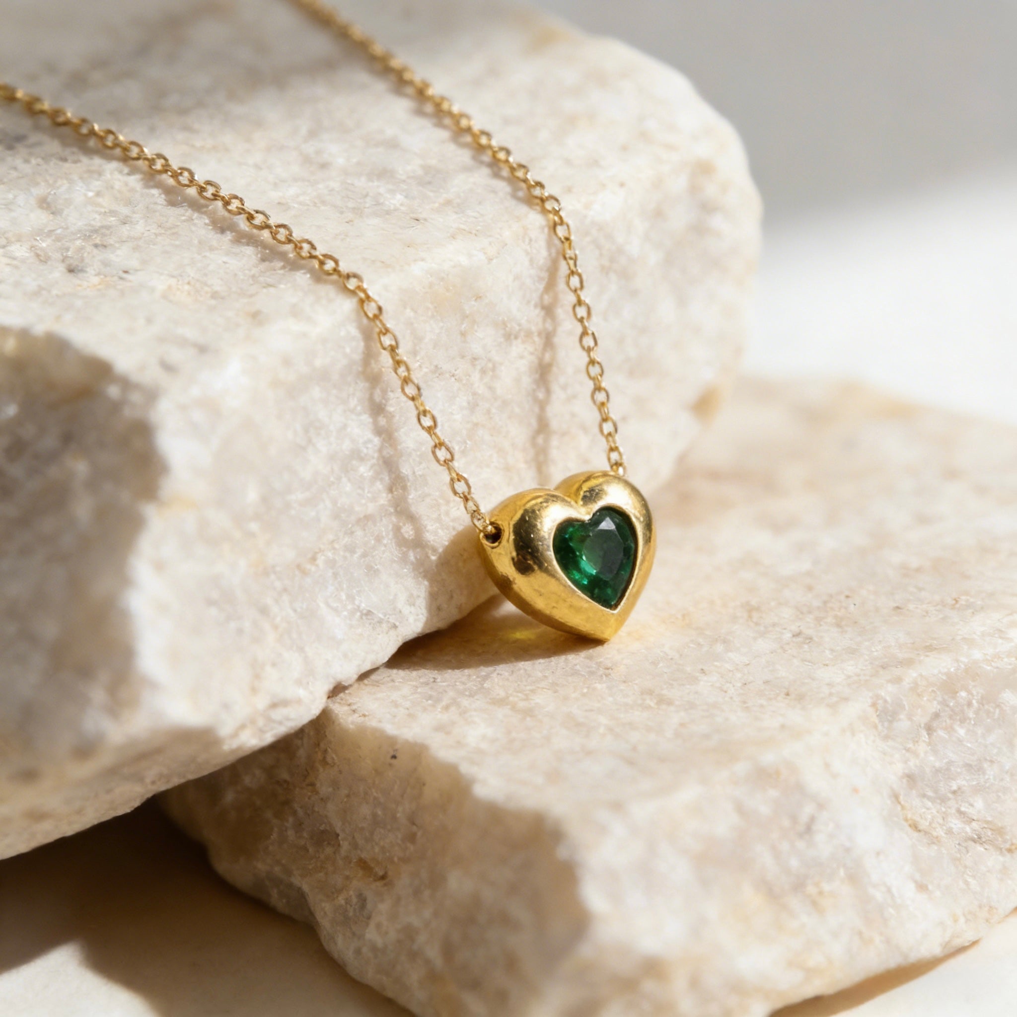 18K gold plated over sterling silver heart-in-heart green zircon necklace featuring a central black heart-shaped zircon on a dainty gold chain