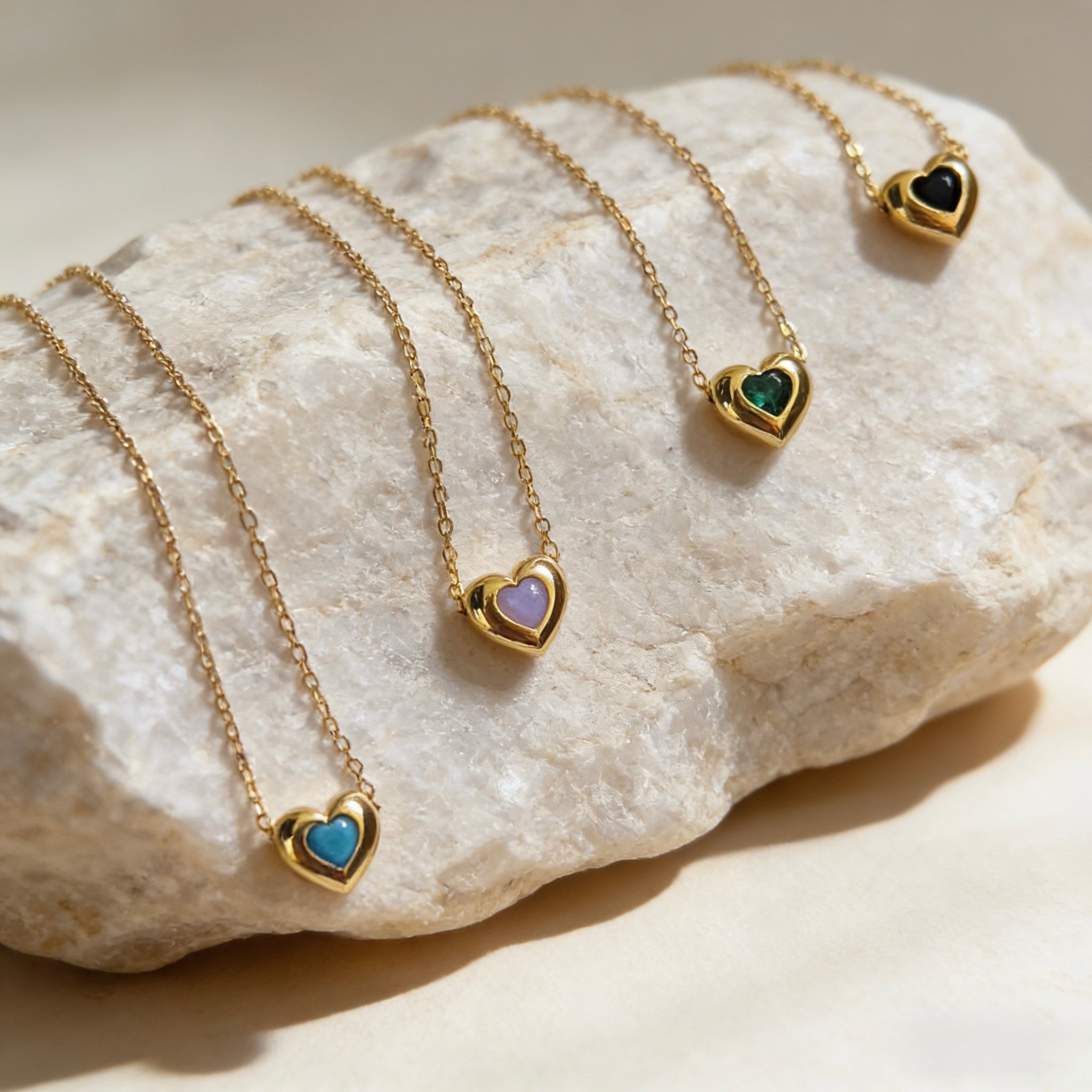18K gold plated over sterling silver heart-in-heart green zircon necklace featuring a central black heart-shaped zircon on a dainty gold chain