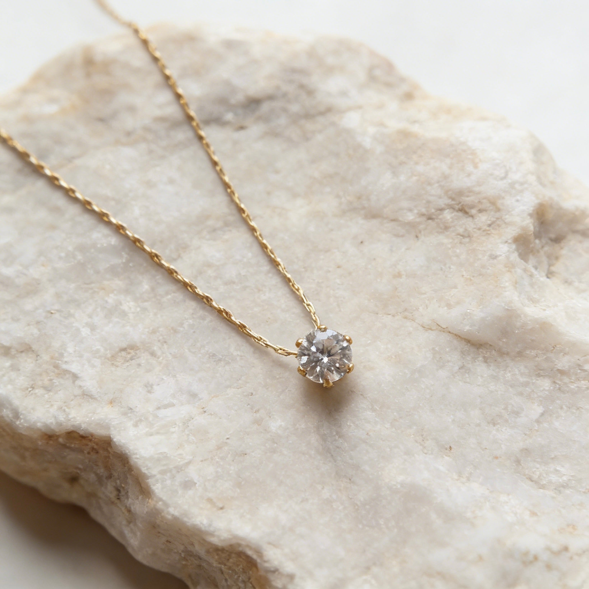 18K gold plated stainless steel necklace with a single round sparkling zircon solitaire pendant. Dainty Solitaire Diamond Necklace, 18K Gold Plated Stainless Steel, Waterproof Sparkly Round Zircon Pendant, Tarnish Free Everyday Jewelry