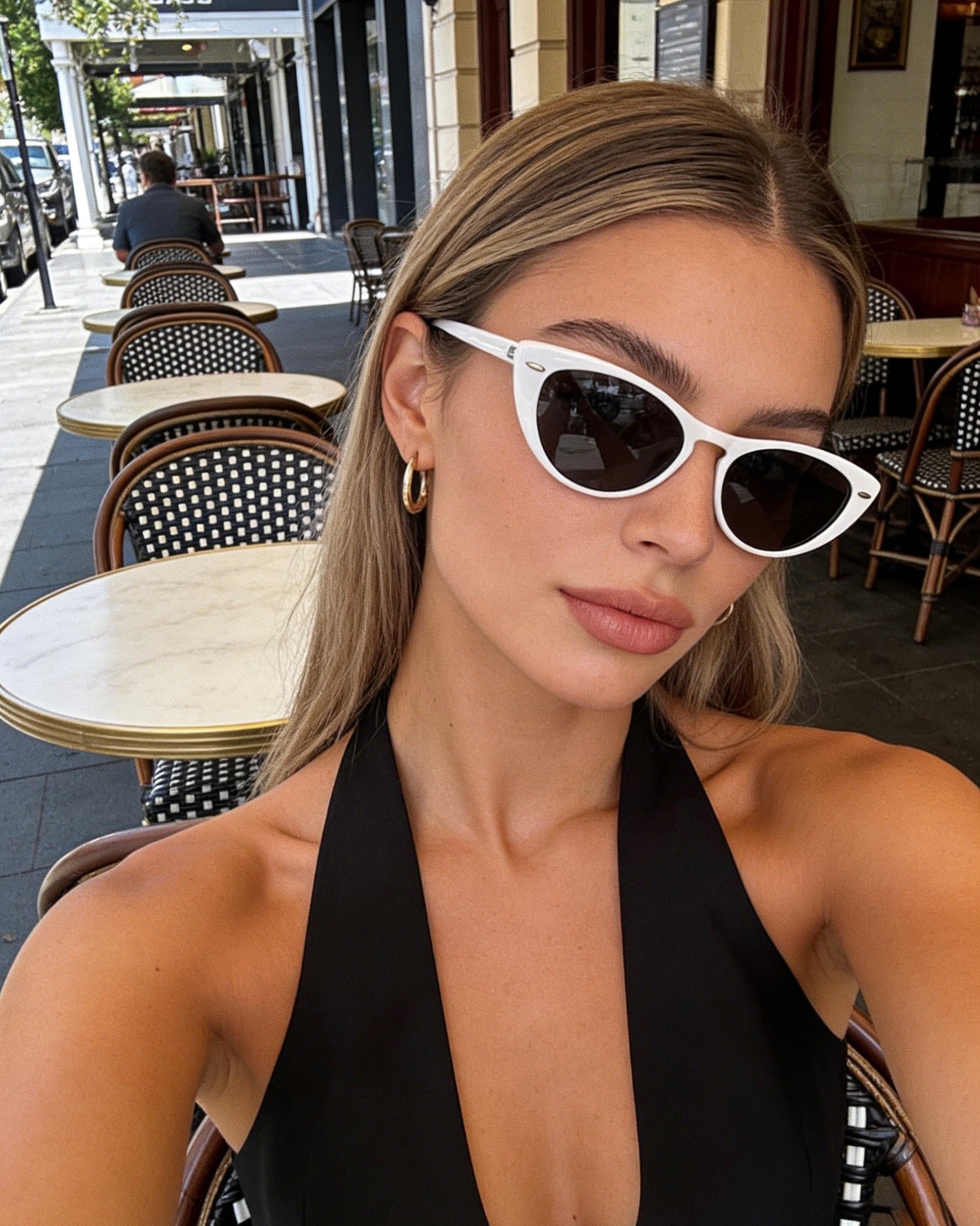 Modern white frame cat-eye sunglasses featuring grey polarized lenses and 100% UV protection, vintage aesthetic fashion sunglasses.