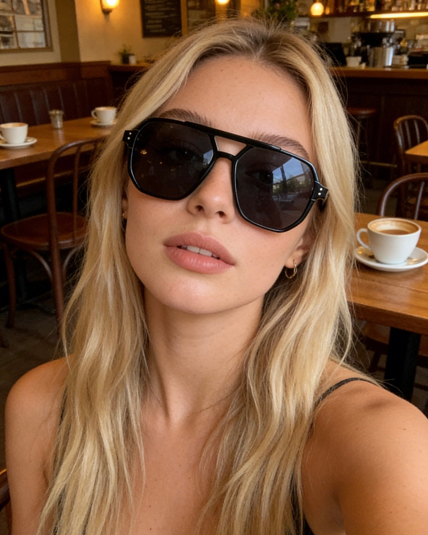Oversized black aviator sunglasses with a flat top bridge, polarized lenses, and UV protection, unisex retro square eyewear.