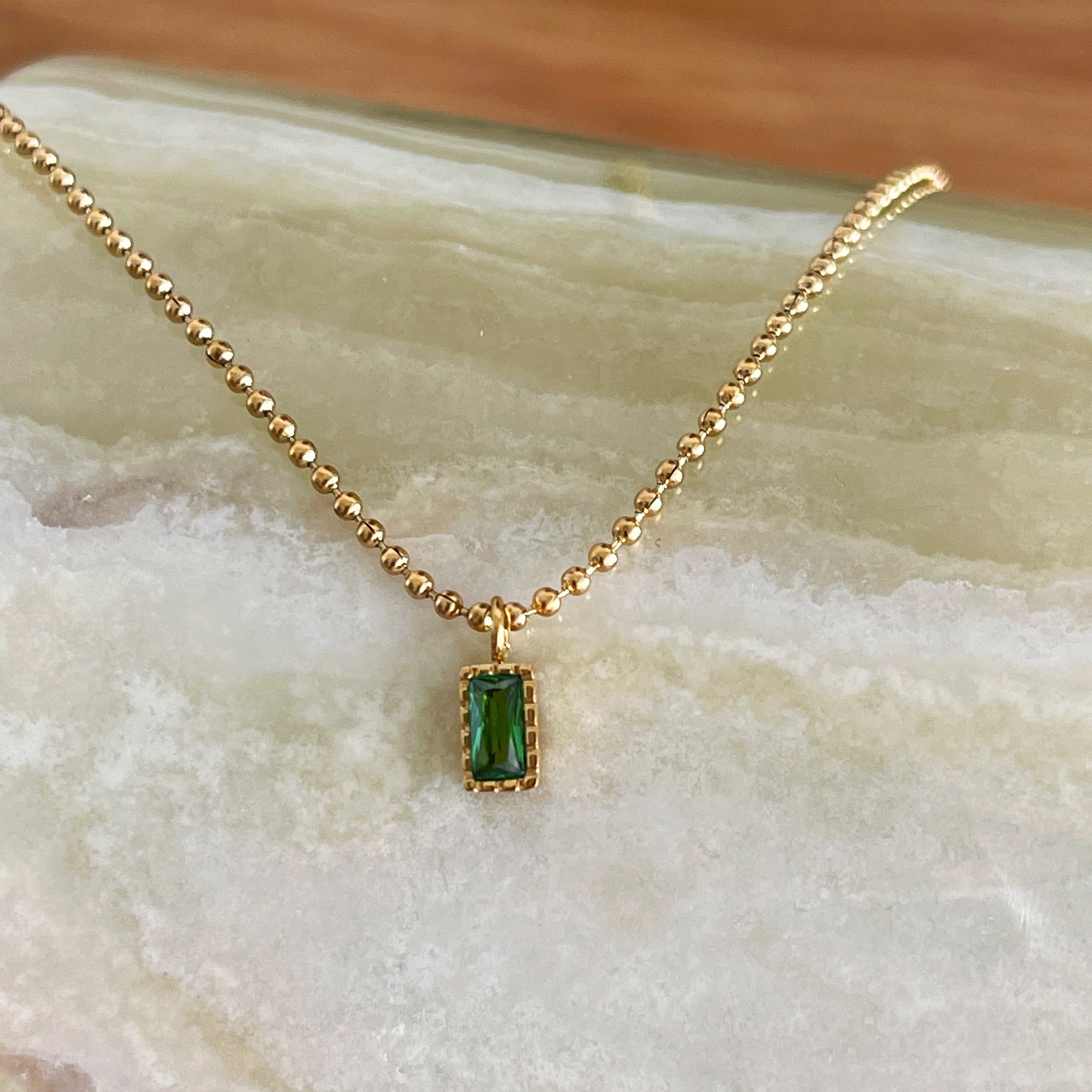 Gold plated beaded chain necklace with emerald cut green pendant, dainty minimalist jewelry. Trendy gold plated ball chain necklace with emerald green rectangular pendant, delicate everyday wear.