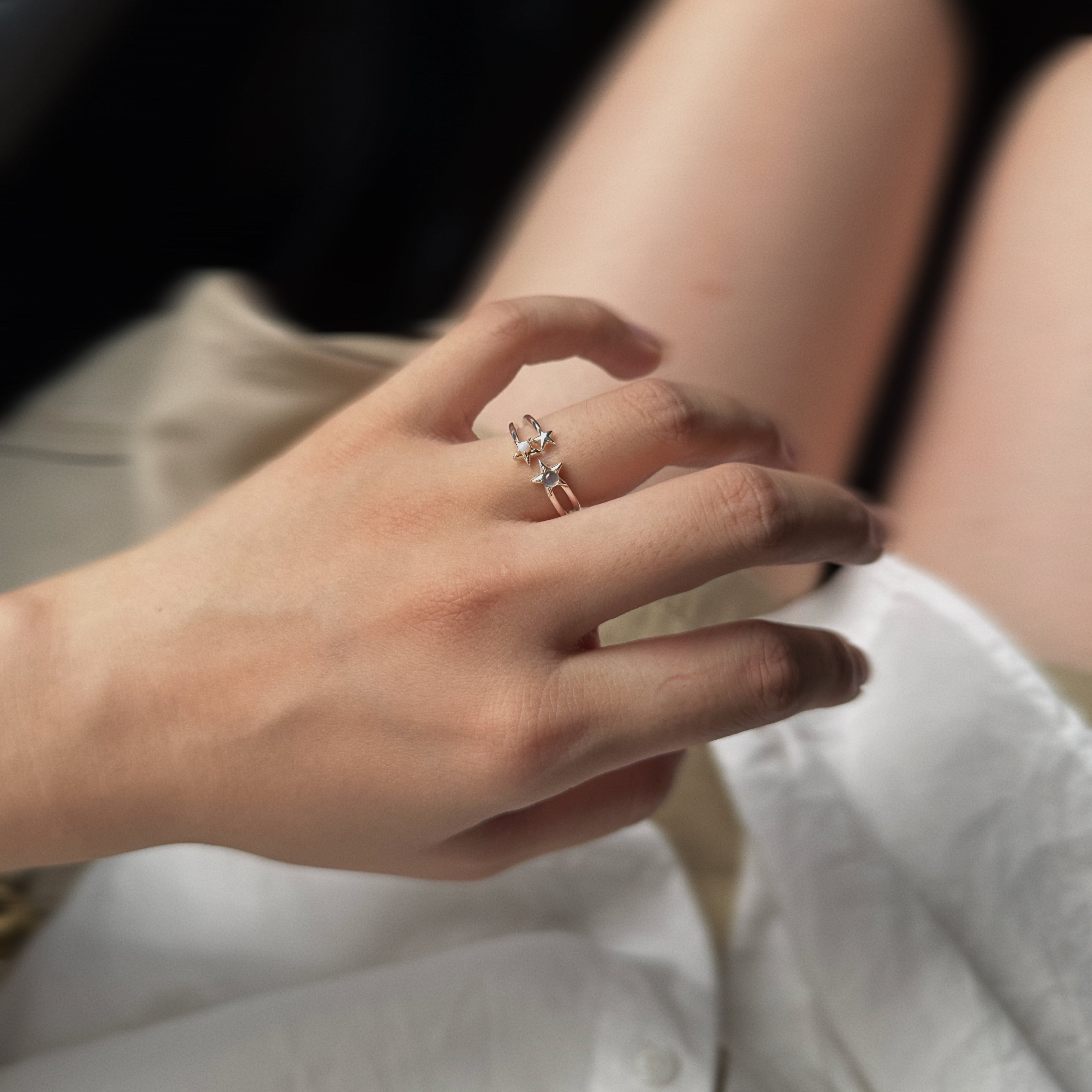 Whimsical 925 sterling silver celestial open ring featuring double star motifs with moonstone accents, polished metallic finish for modern celestial jewelry. This open celestial ring is dainty, stackable, and perfect for everyday wear. 