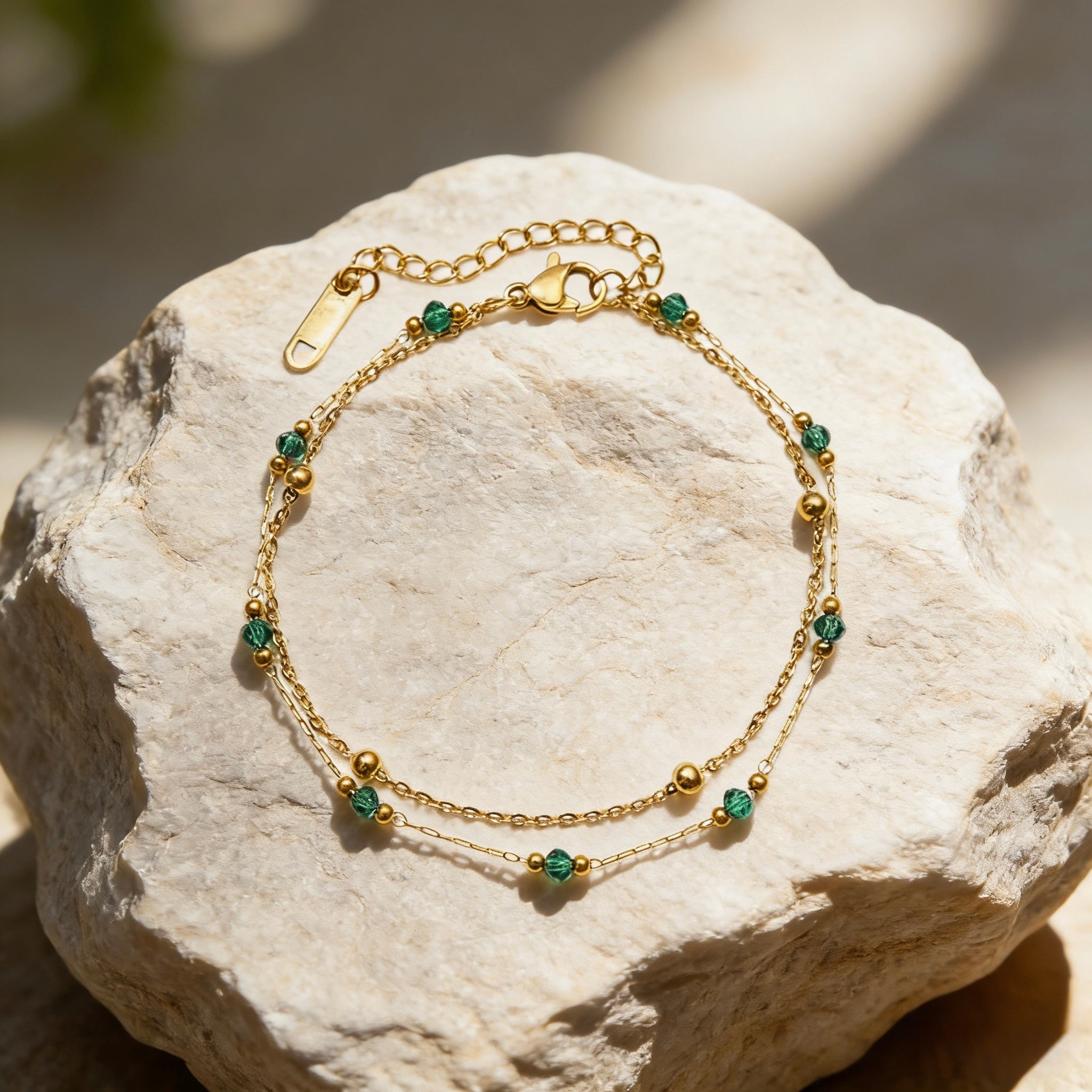 18K gold plated stainless steel double layer bracelet featuring alternating gold beads and emerald green crystal accents. Waterproof Green Bead Stacking Bracelet, Tarnish Free Boho Jewelry