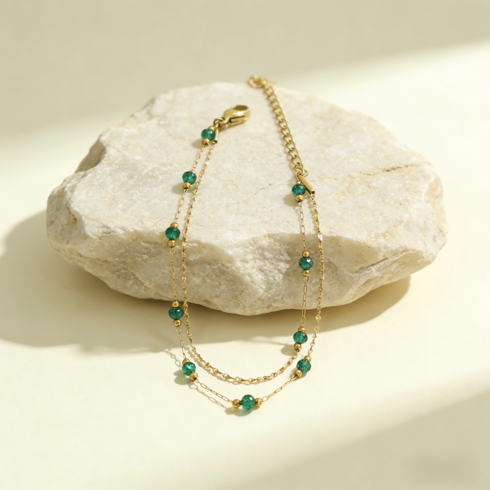 18K gold plated stainless steel double layer bracelet featuring alternating gold beads and emerald green crystal accents. Waterproof Green Bead Stacking Bracelet, Tarnish Free Boho Jewelry