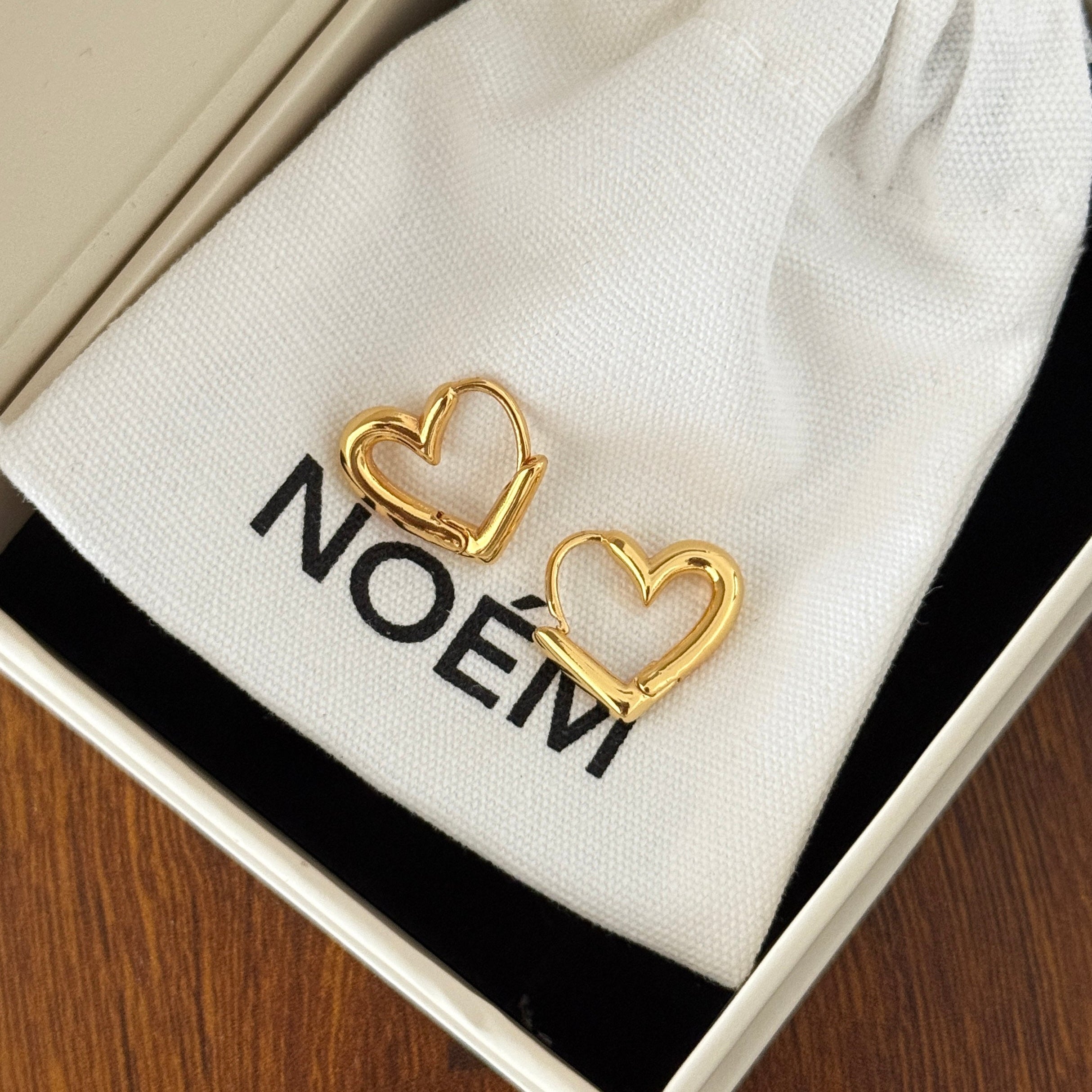 Pair of minimalist 18K gold plated heart hoop earrings featuring unique V-shape architectural lines and S925 sterling silver posts for sensitive ears