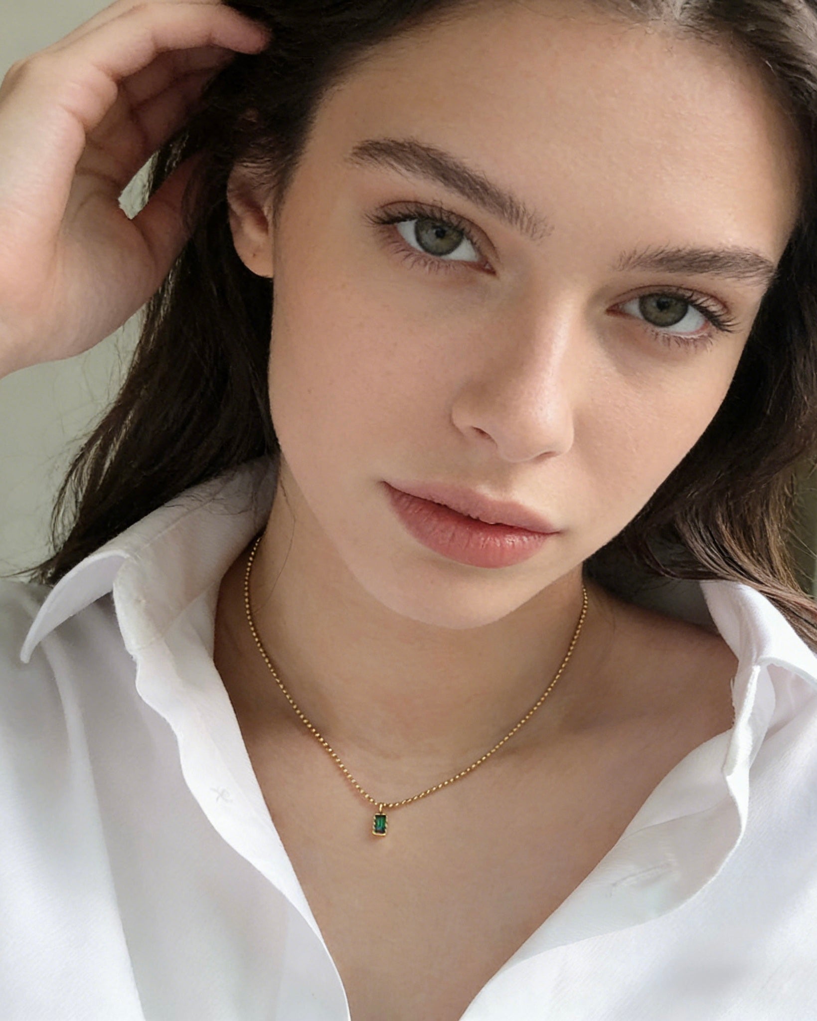 Gold plated beaded chain necklace with emerald cut green pendant, dainty minimalist jewelry. Trendy gold plated ball chain necklace with emerald green rectangular pendant, delicate everyday wear.
