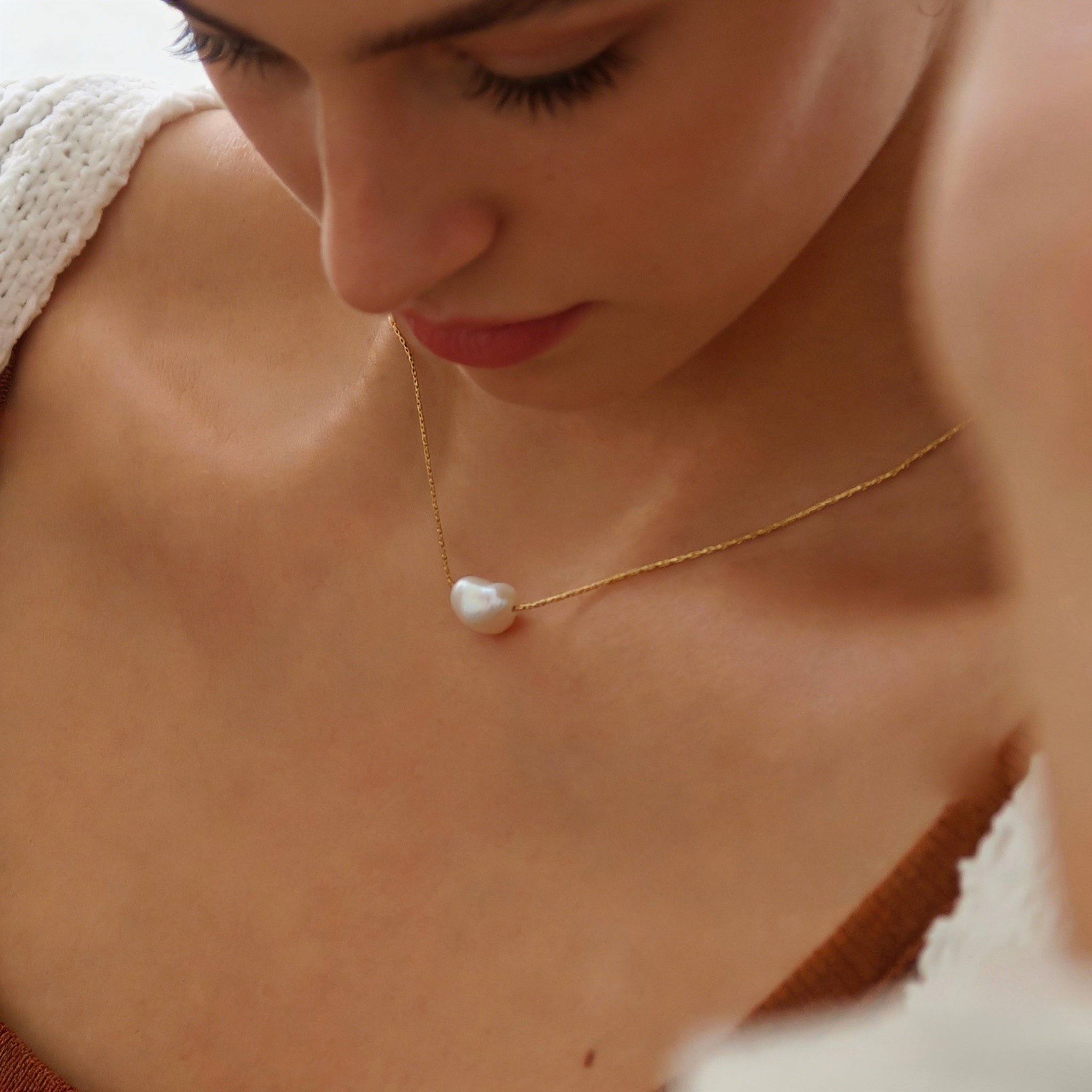 Minimalist 18K gold plated floating necklace with a natural white freshwater baroque pearl on a dainty cable chain