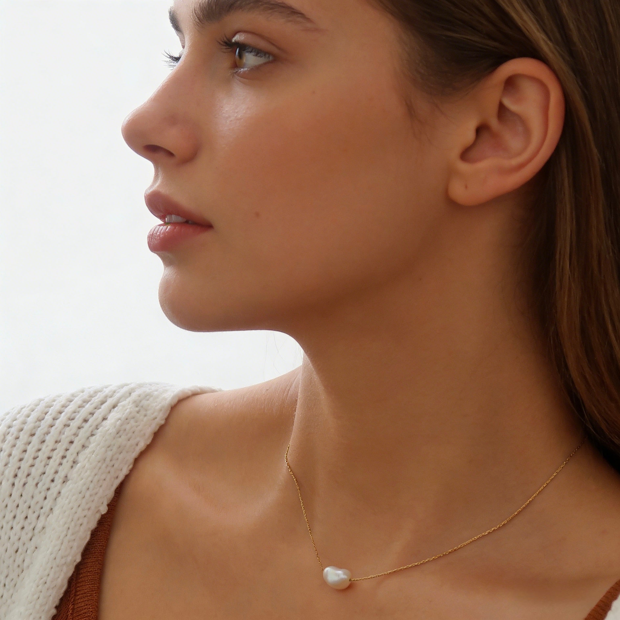 Minimalist 18K gold plated floating necklace with a natural white freshwater baroque pearl on a dainty cable chain