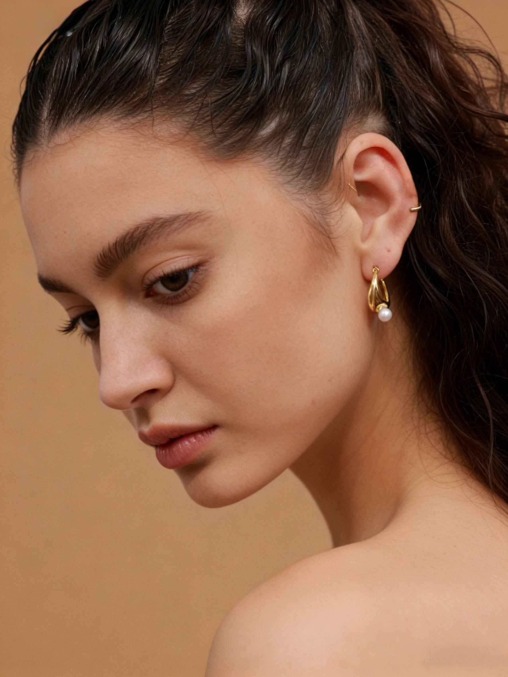 Modern 18K gold plated ribbon twist earrings with S925 sterling silver posts and a natural freshwater pearl drop