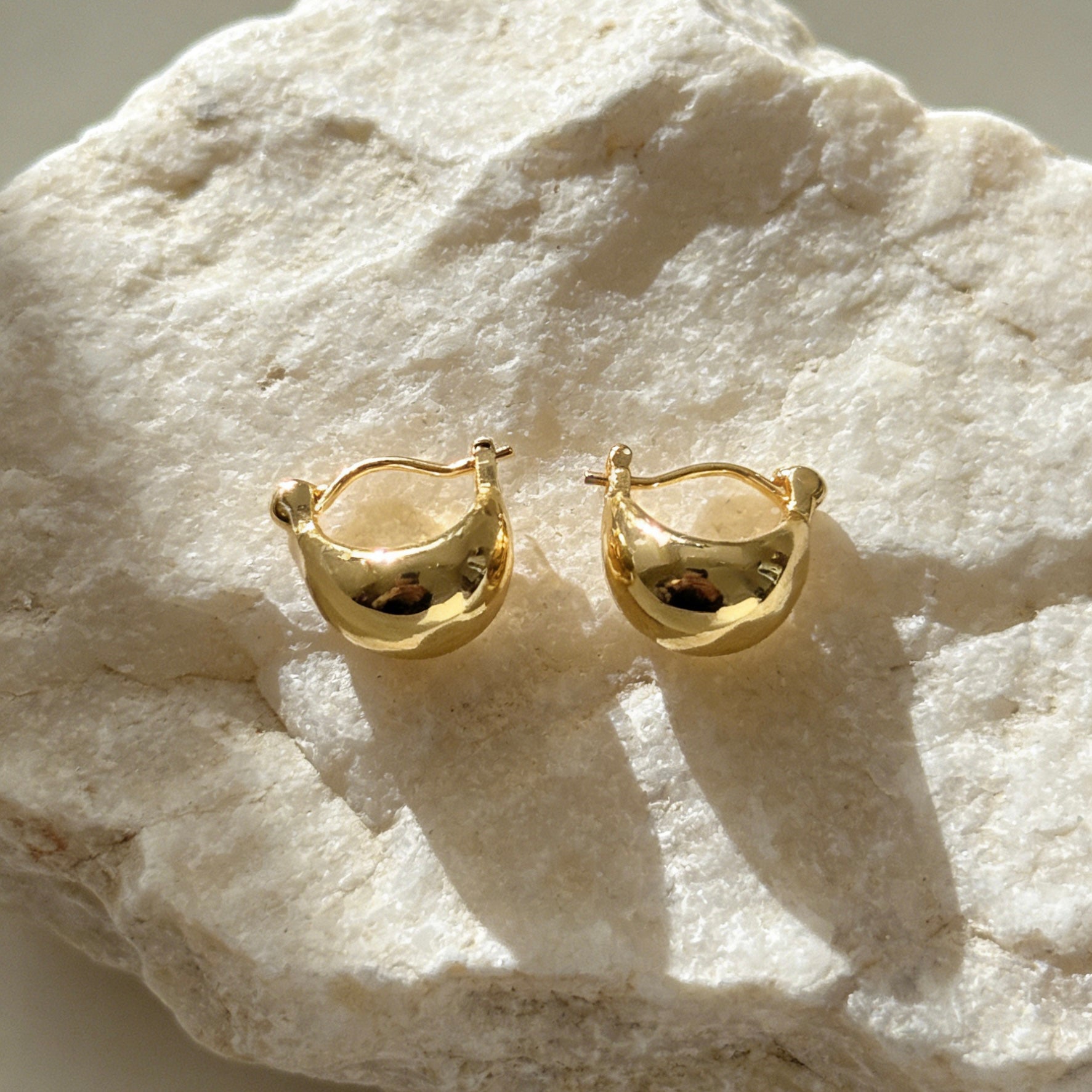 Pair of minimalist 18K gold plated chubby hoop earrings with a high-polished waterdrop silhouette