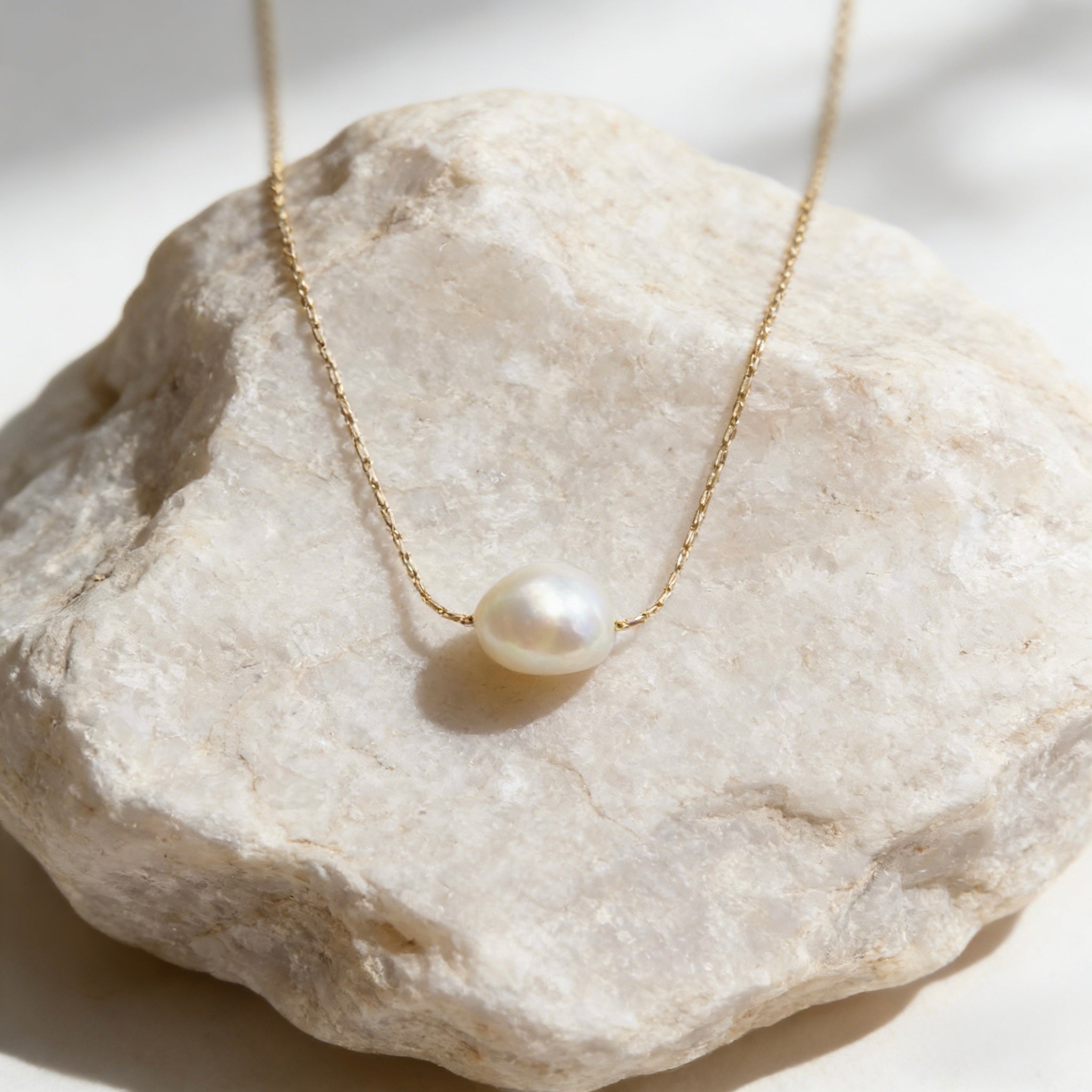 Minimalist 18K gold plated floating necklace with a natural white freshwater baroque pearl on a dainty cable chain