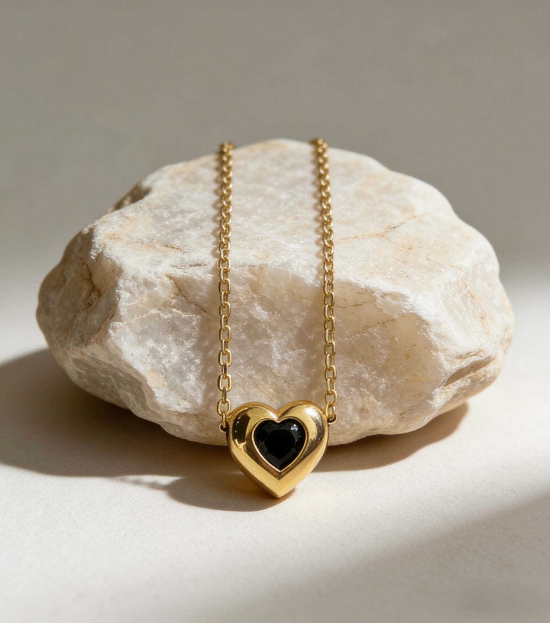 18K gold plated over sterling silver heart-in-heart green zircon necklace featuring a central black heart-shaped zircon on a dainty gold chain