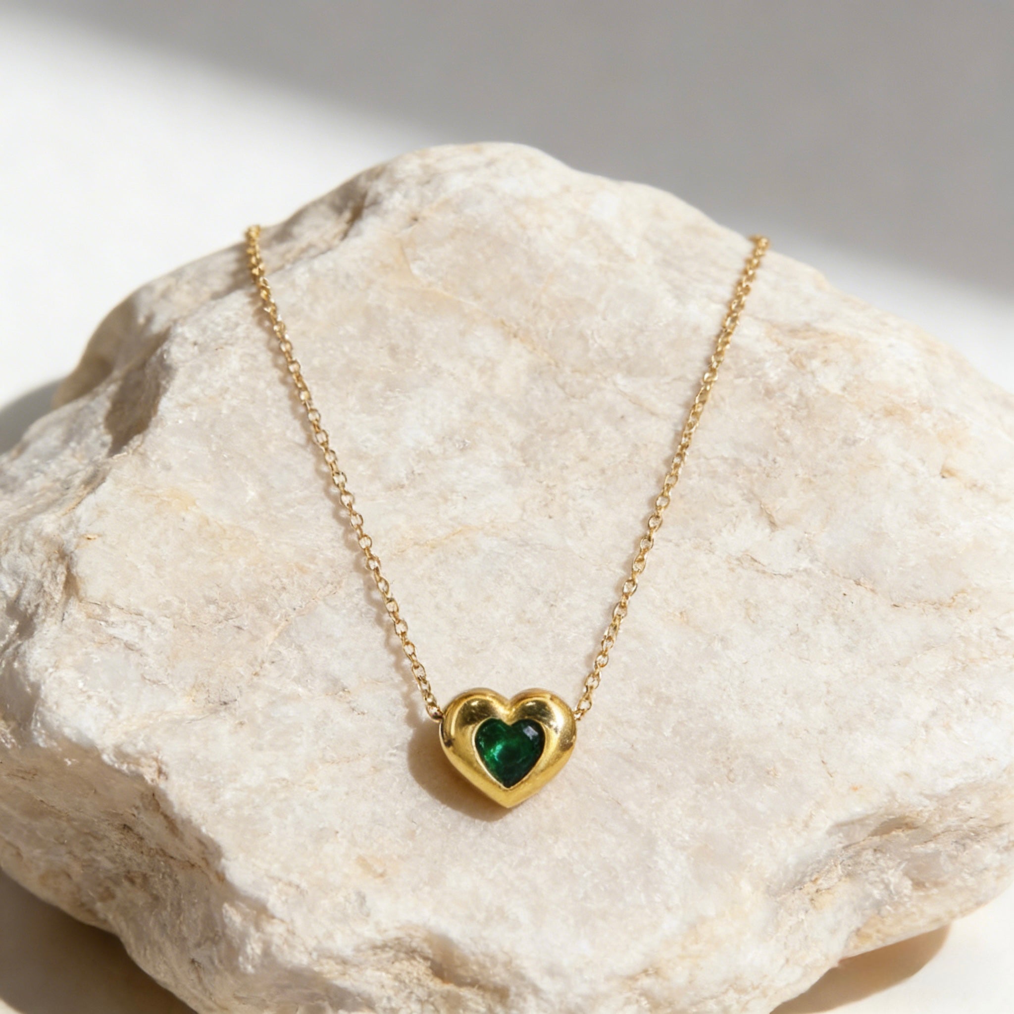 18K gold plated over sterling silver heart-in-heart green zircon necklace featuring a central black heart-shaped zircon on a dainty gold chain