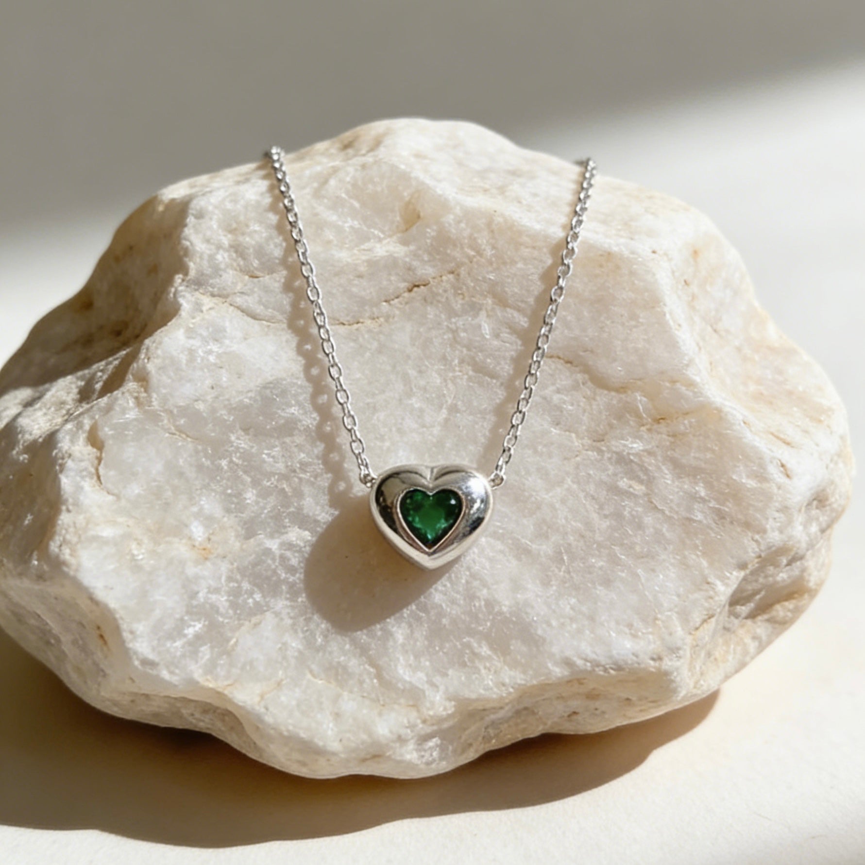 18K gold plated over sterling silver heart-in-heart green zircon necklace featuring a central black heart-shaped zircon on a dainty gold chain