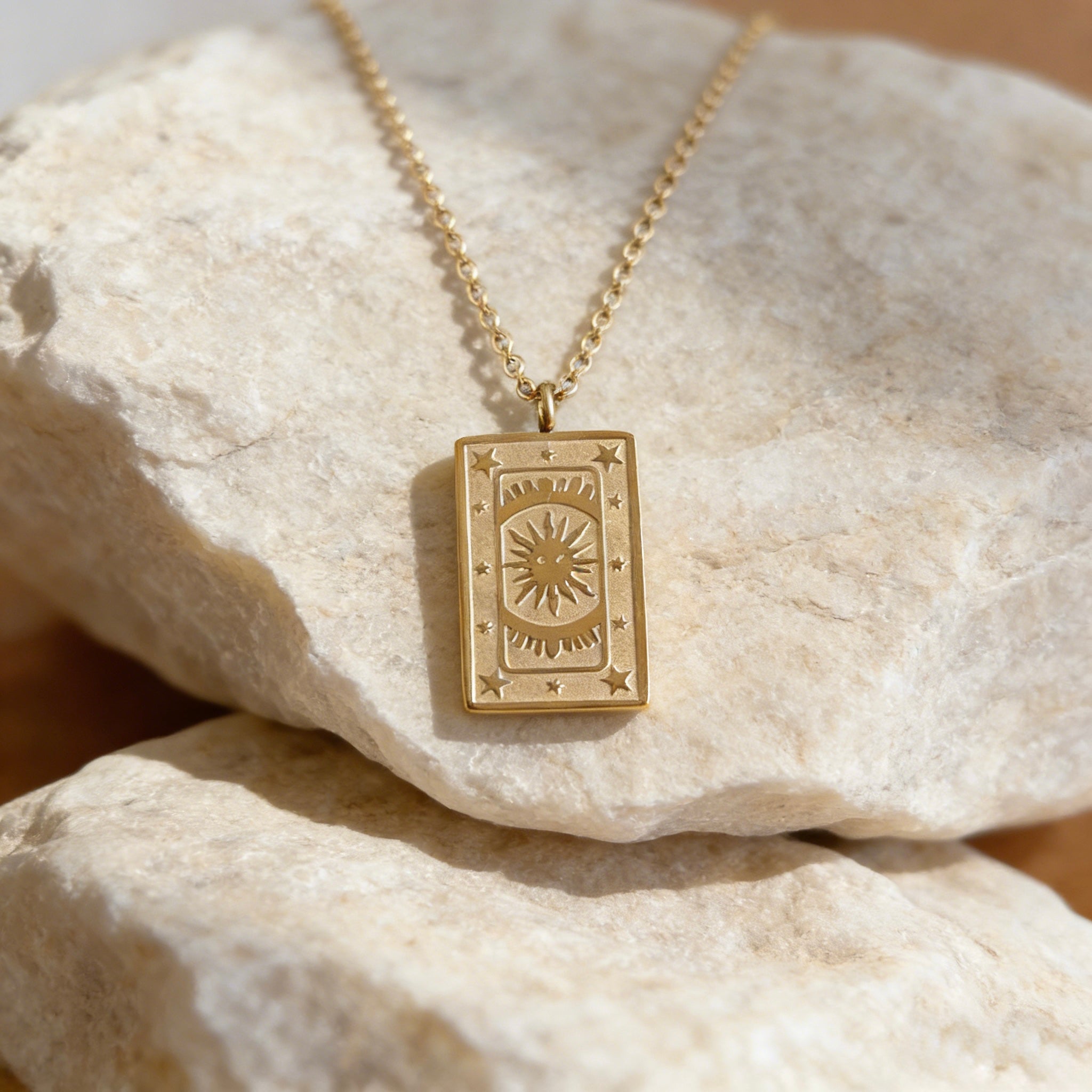 18K gold plated stainless steel tarot card necklace featuring "The Sun" pendant with sunburst and star engravings, dainty gold chain jewelry